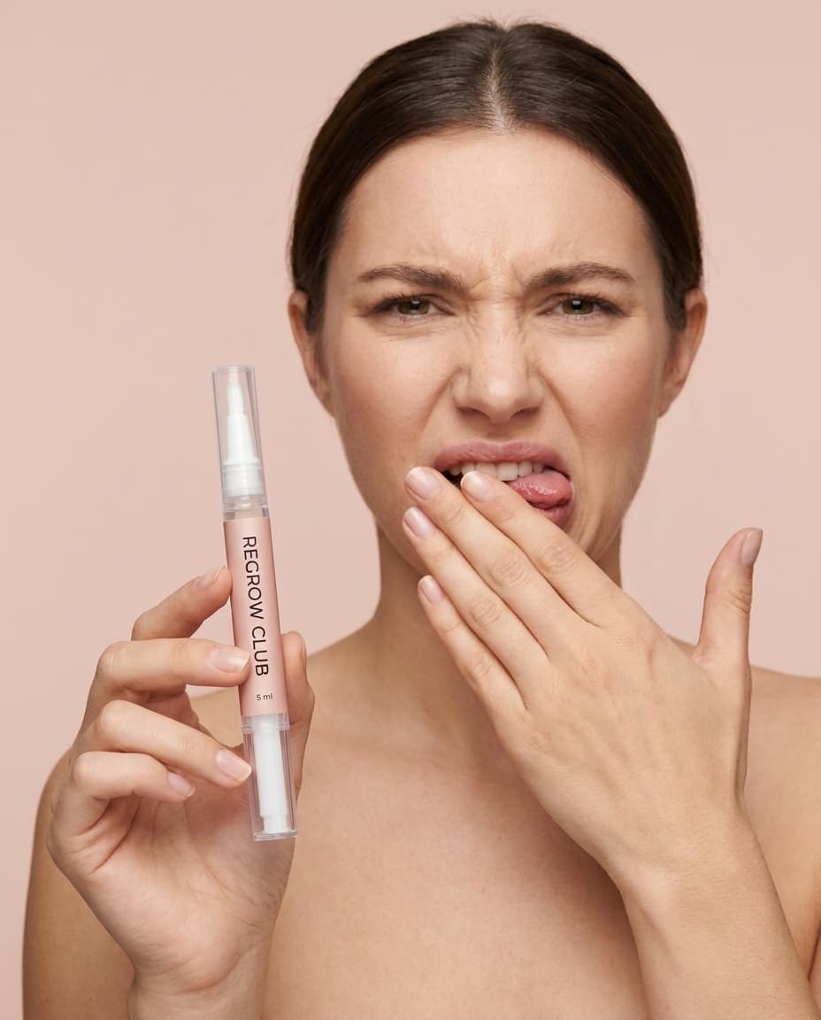 Woman reacting to the bitter taste of Regrow Club